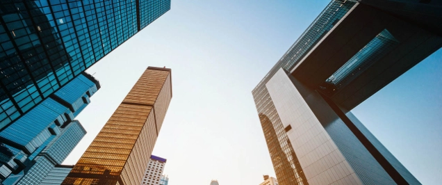 Low angle view of modern financial skyscrapers in Central Business District, Hong Kong at sunrise